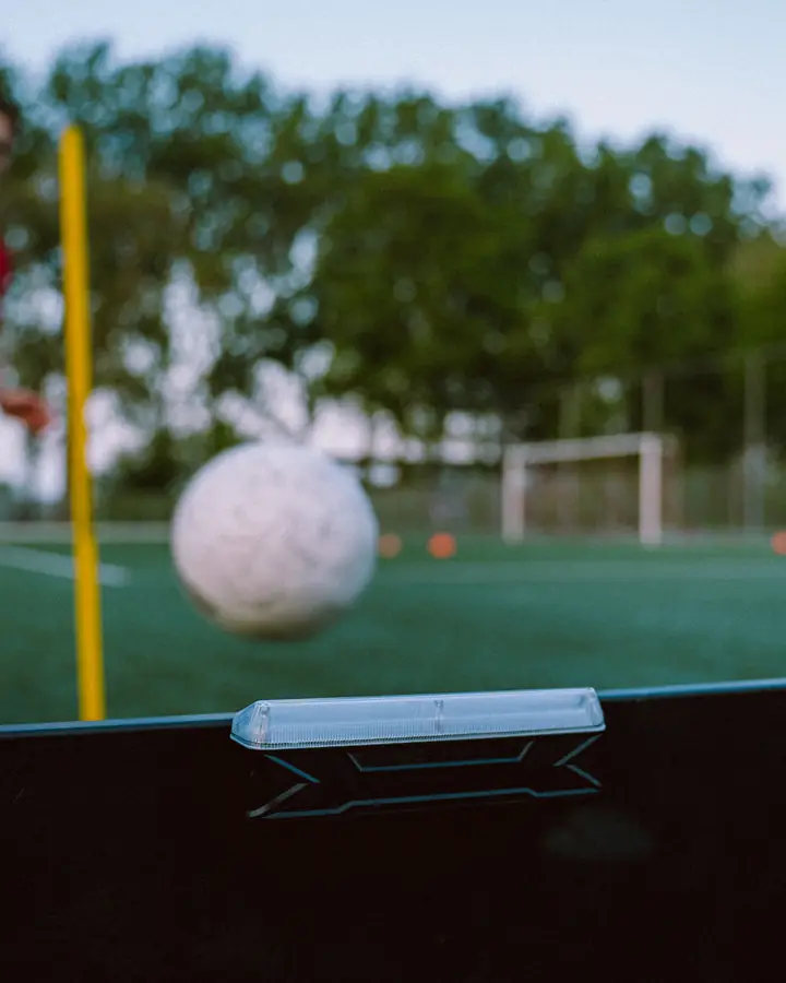 Player with a ball in front of the rebounder