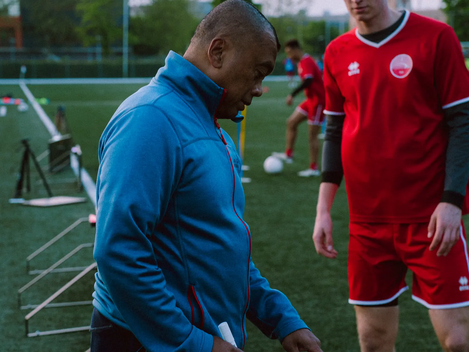 Coach and player at the Beams during a football session